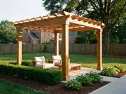 Freestanding cedar pergola on a concrete slab in the middle of a lawn, separate from the house