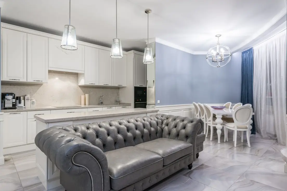 A small apartment's combined kitchen and living room styled on a modest budget with consistent finishes