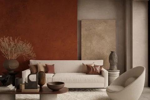 An organic modern living room with a terracotta accent wall, a cream boucle sofa, and a live-edge wood coffee table