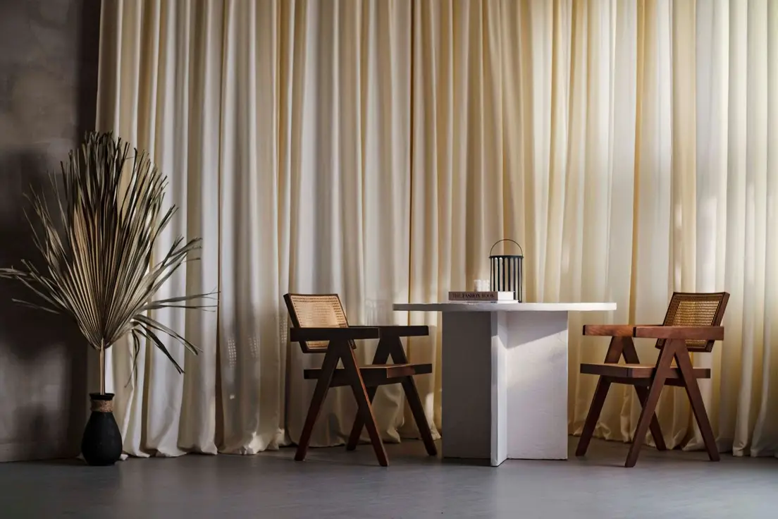 A pared-back japandi entryway with a plywood chair, pine cabinet, and minimalist line-art print
