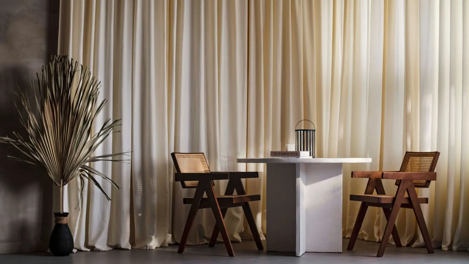 A pared-back japandi entryway with a plywood chair, pine cabinet, and minimalist line-art print