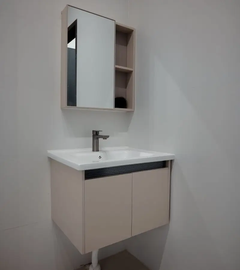 A floating bathroom vanity with a mirrored medicine cabinet and open shelving above it