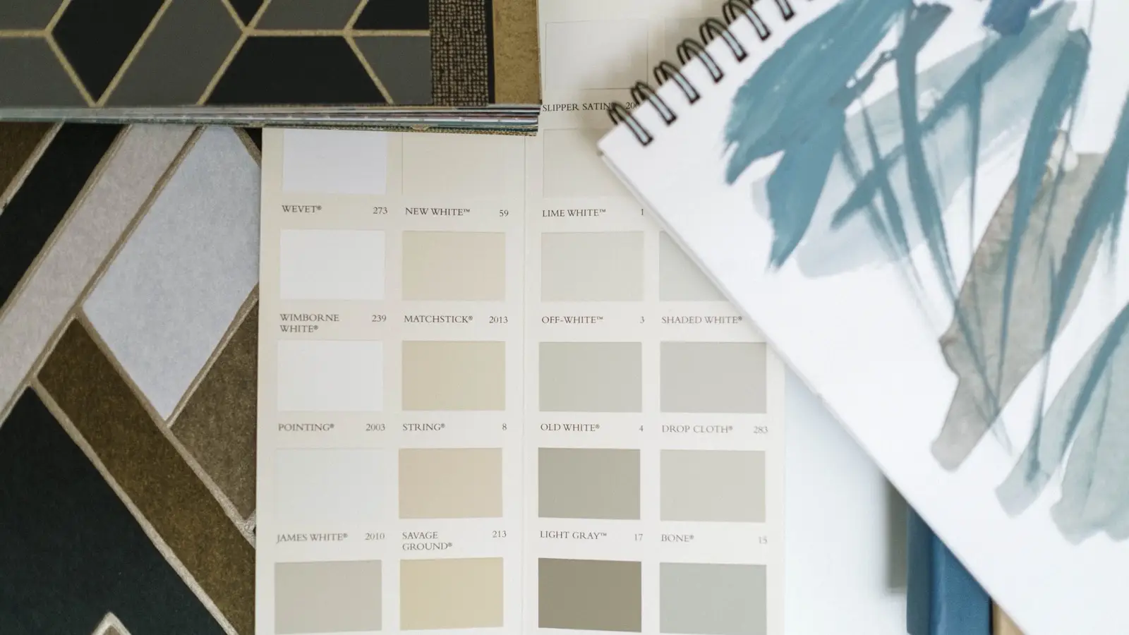 A neutral warm-white paint swatch book with color names for a modern farmhouse palette