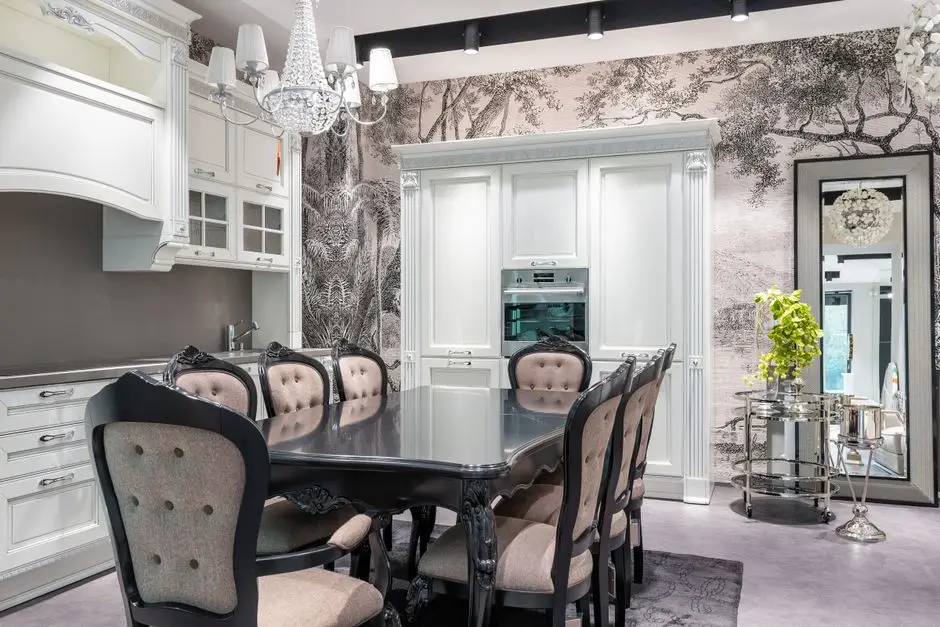 A kitchen and dining nook with a patterned removable wallpaper accent wall