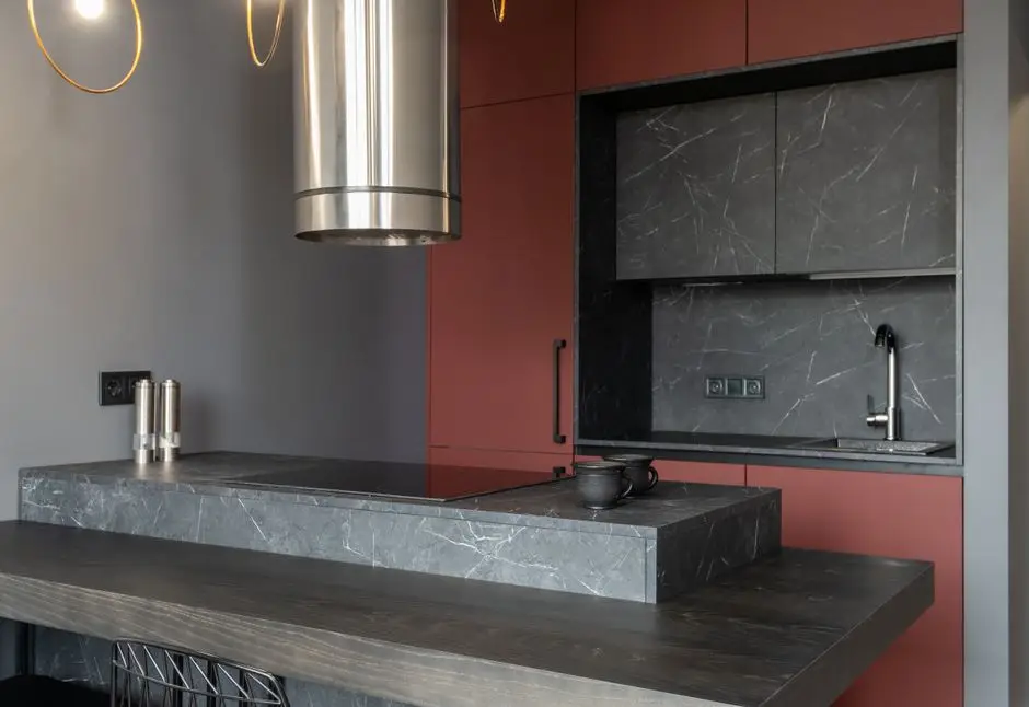 A rolling kitchen island cart adding counter space in a small apartment kitchen