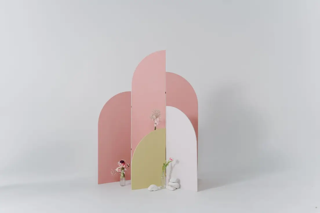 A pastel-toned modular panel wall divider setup, illustrating a temporary wall kit for room division