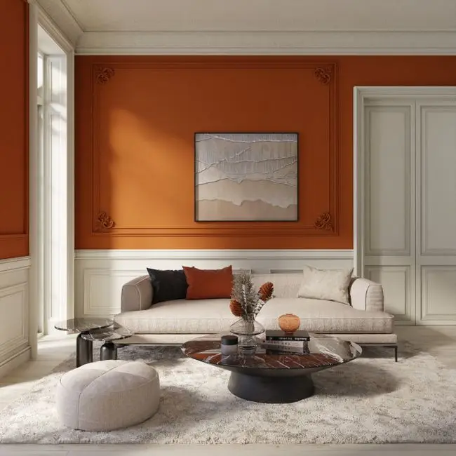 A living room with a terracotta earth-tone accent wall, an organic modern living room decor idea