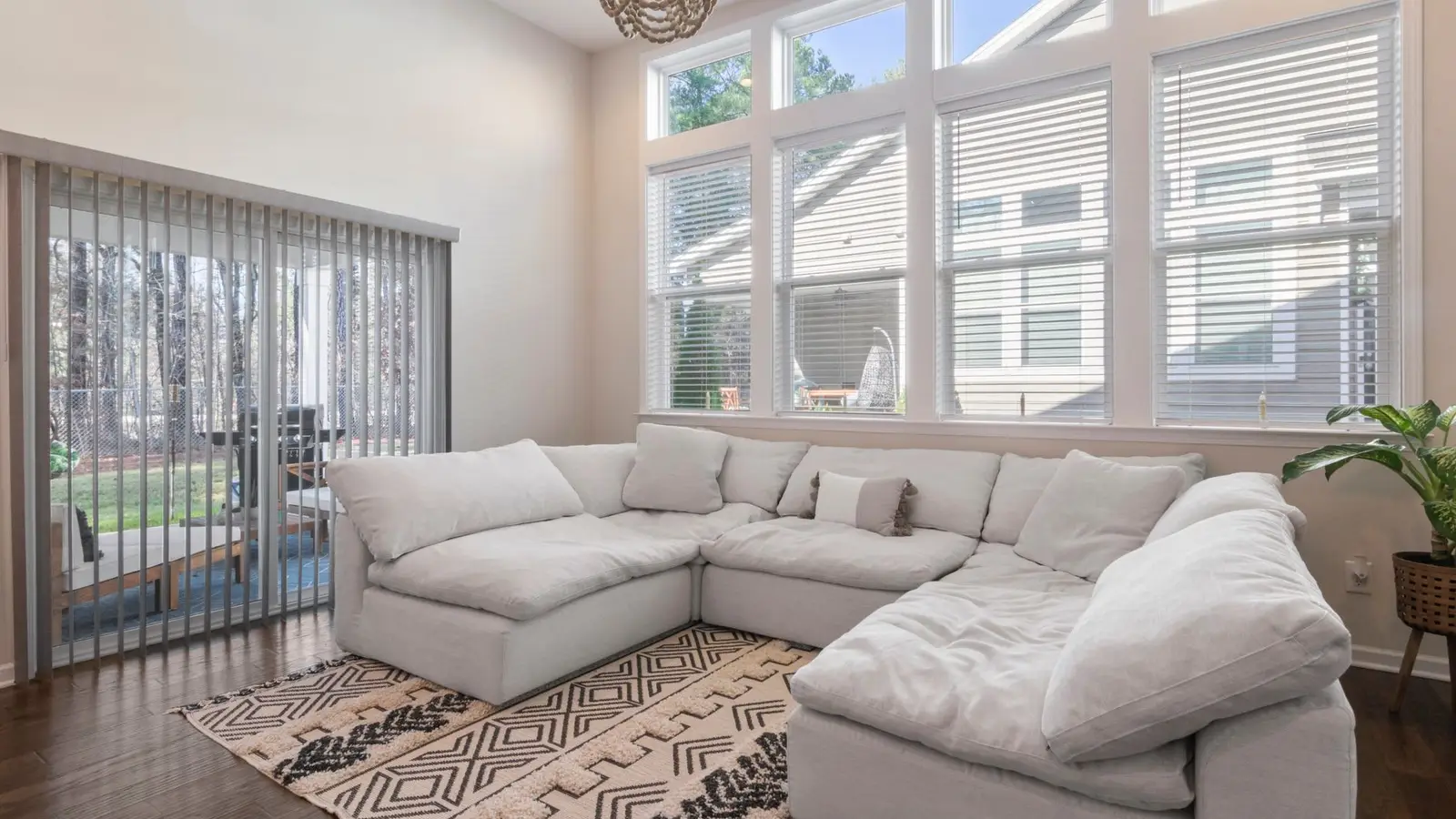 A large modular sectional sofa with clear floor space around it in a small living room