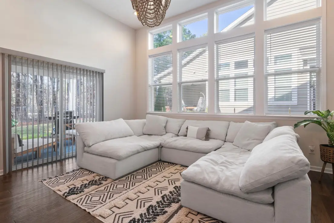 A large modular sectional sofa with clear floor space around it in a small living room