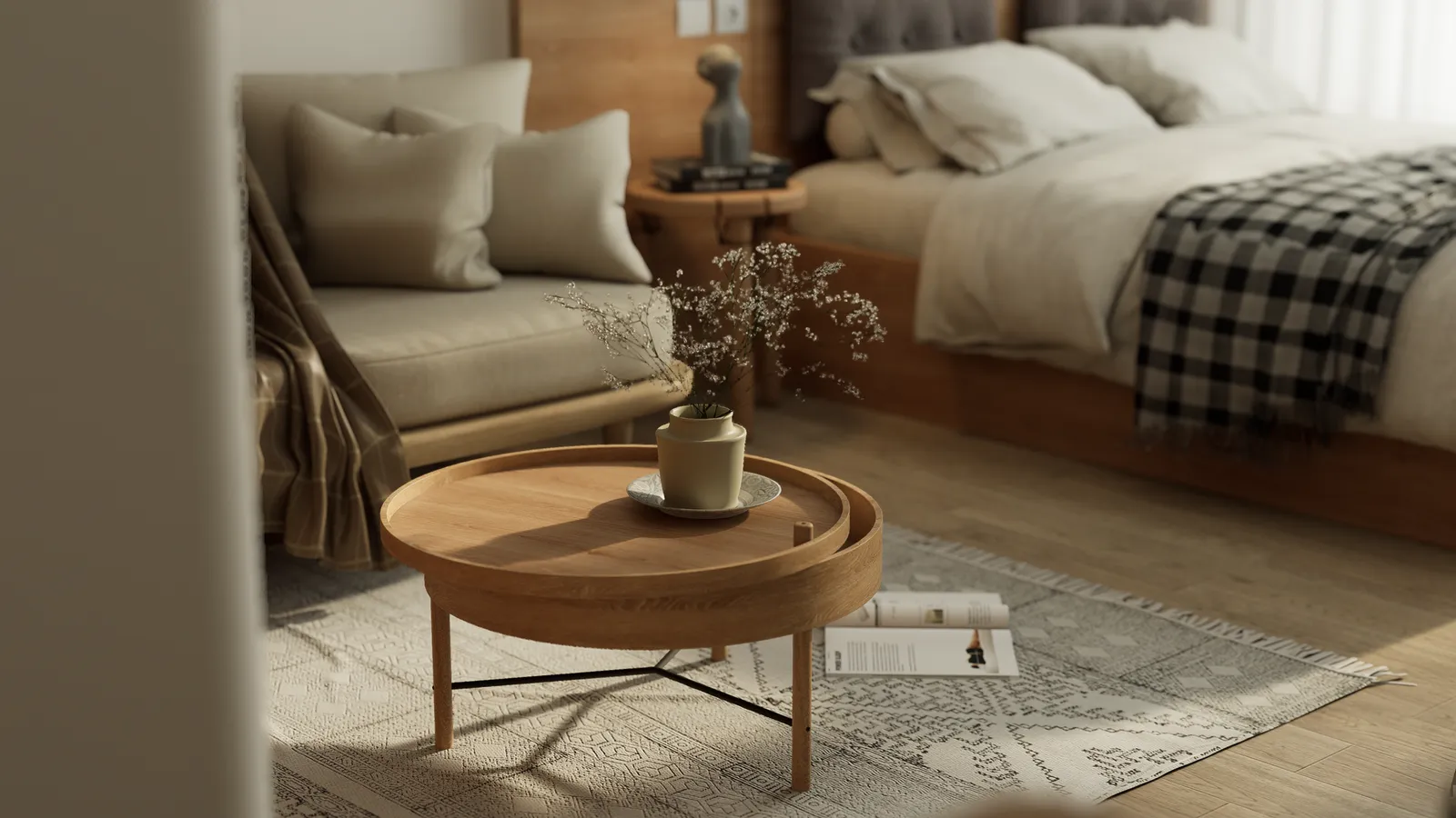 A warm wood round tray table with a small vase beside a linen sofa in a Scandinavian-style bedroom